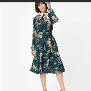 Unique Vintage brand green floral belted dress